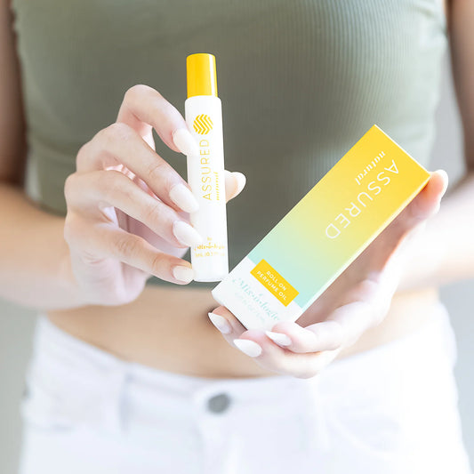 Assured Perfume Oil Roll On | Mix O Logie with lasting fragrance, in a yellow and white box. Available sizes: 5ml, 10ml.
