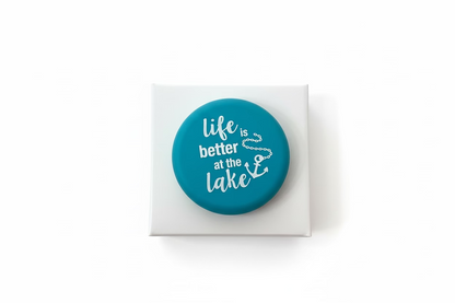 Round teal Wine Cap with “life is better at the lake” in white and a small anchor. Sizes available.