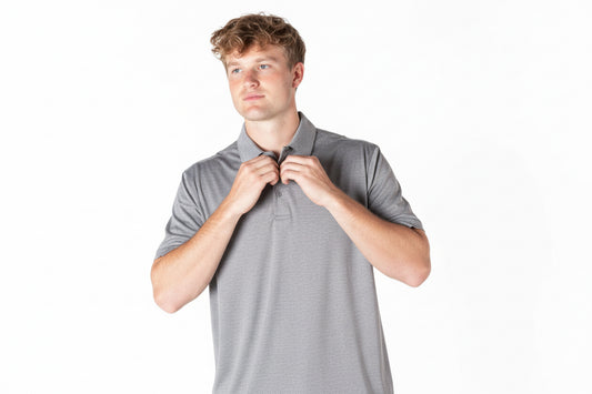 Men’s grey polo shirt with classic collar and button detail, available in sizes S-XXL.