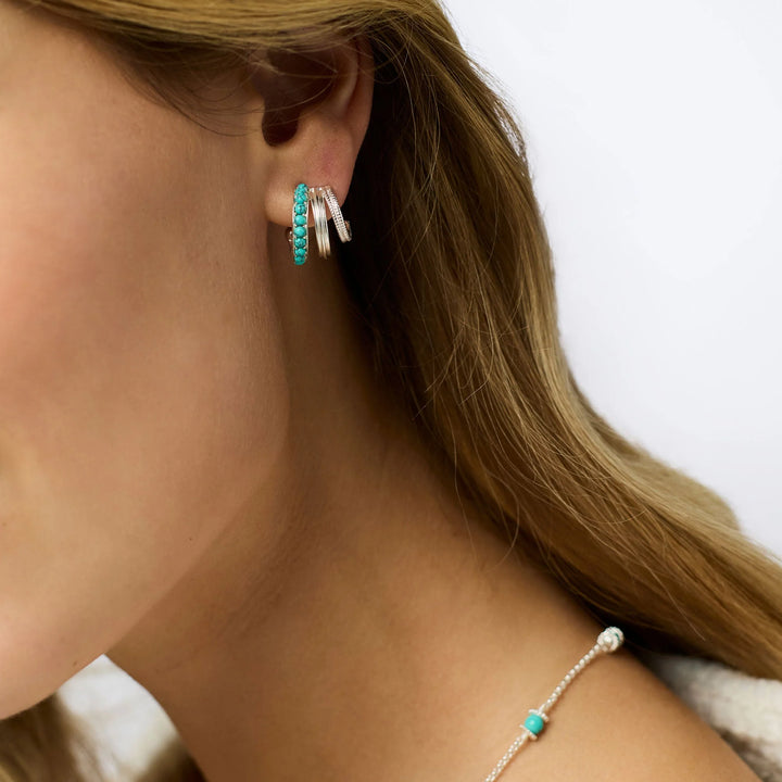 Hydra Triple Hoop: two hoops with turquoise stones, one with clear stones. Available in sizes S, M, L.