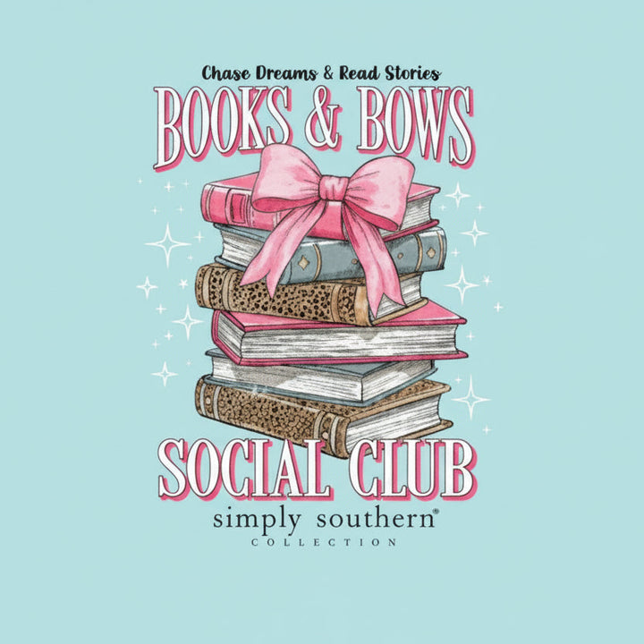 Aqua Books and Bows T-Shirt with books, pink bow, sparkles, and text. Sizes: S-XXL. Literary tee from Simply Southern.