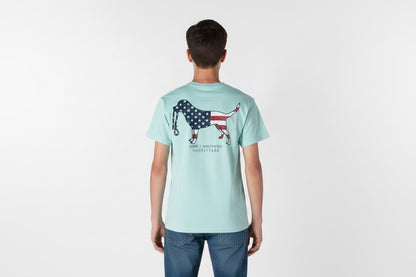 Light blue Men’s Dog USA T-Shirt with flag-filled dog graphic and “SIMPLY SOUTHERN OUTFITTERS” on back. Sizes: S-XXL.