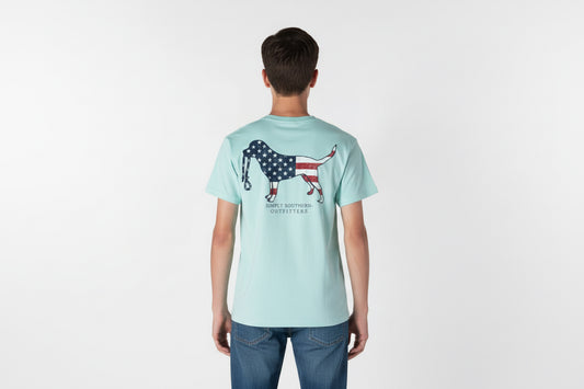 Light blue Men’s Dog USA T-Shirt with flag-filled dog graphic and “SIMPLY SOUTHERN OUTFITTERS” on back. Sizes: S-XXL.
