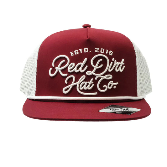 Maroon Red Dirt Hat Co. cap with white script, mesh back, flat brim sticker. Available sizes: S, M, L, XL.