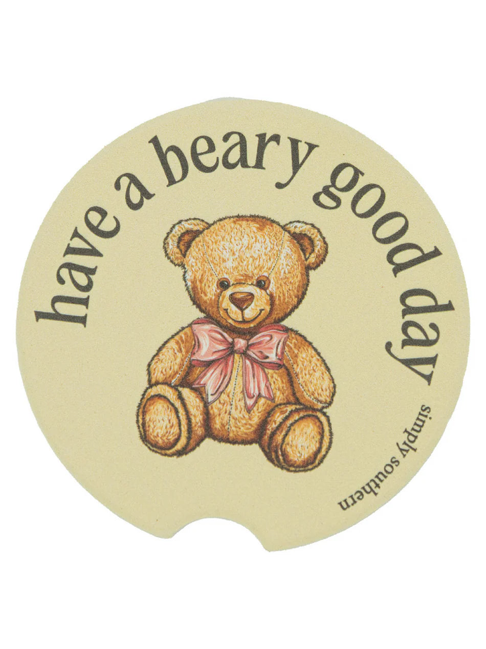 Round beige water-absorbent Simply Southern car coasters, teddy bear with pink bow, "have a beary good day." Sizes: standard.