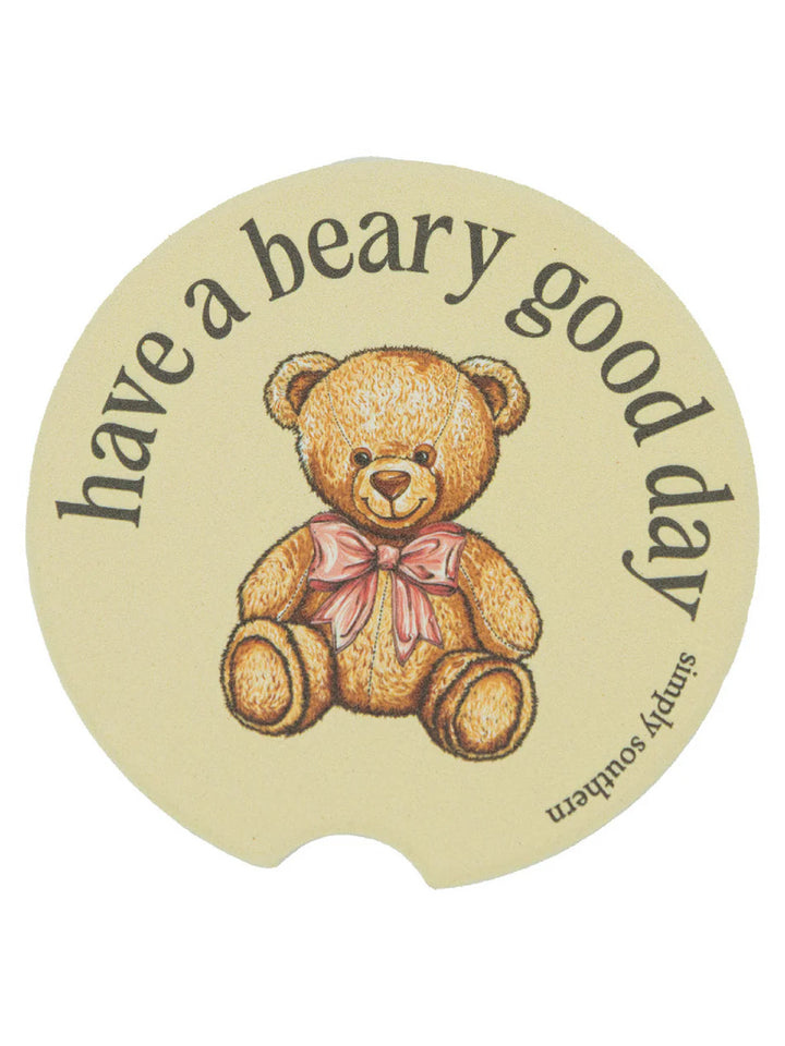 Round beige water-absorbent Simply Southern car coasters, teddy bear with pink bow, "have a beary good day." Sizes: standard.