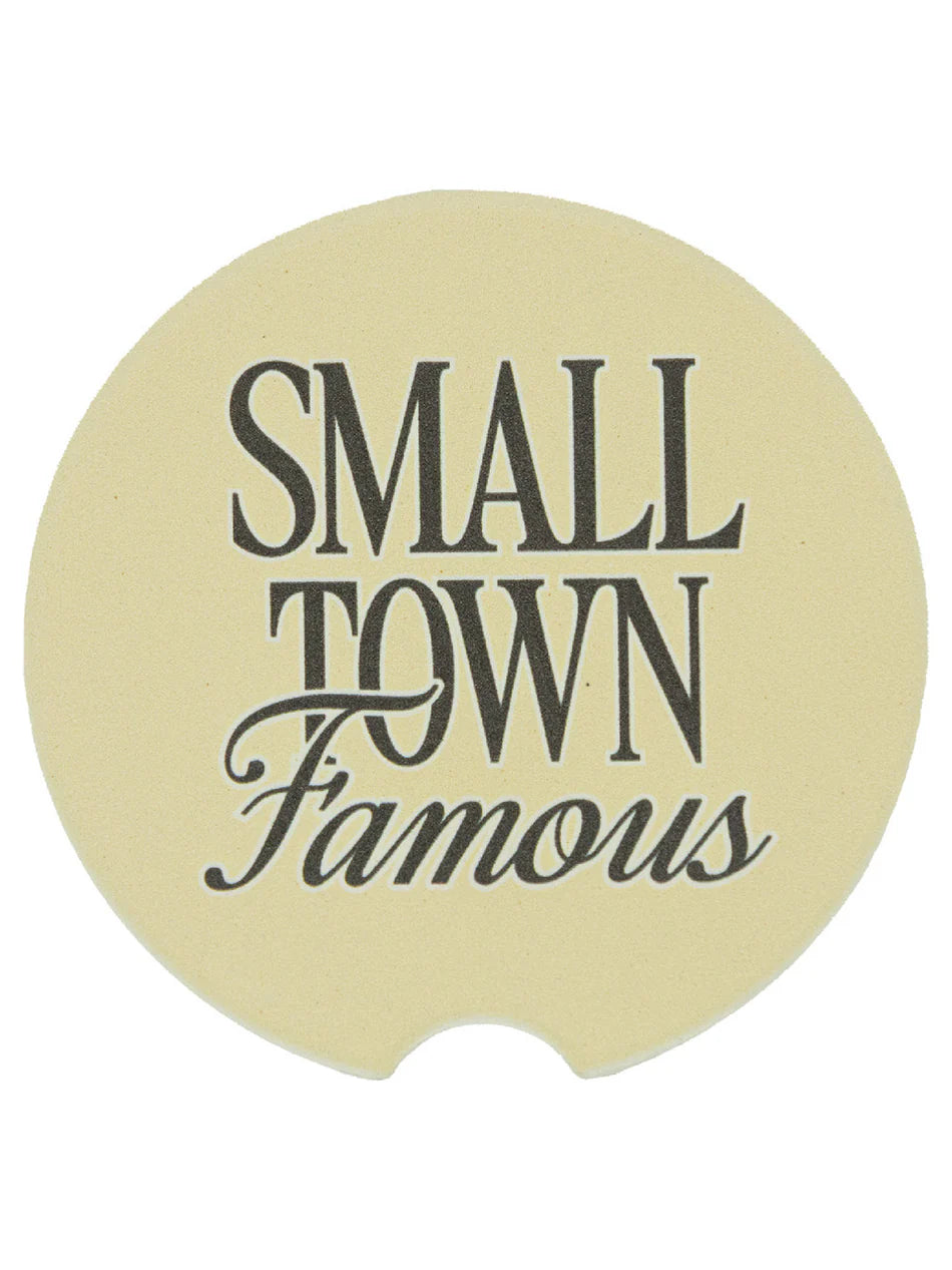 Beige, circular Simply Southern car coasters, "SMALL TOWN Famous" script. Water-absorbent. Fits standard cup holders.