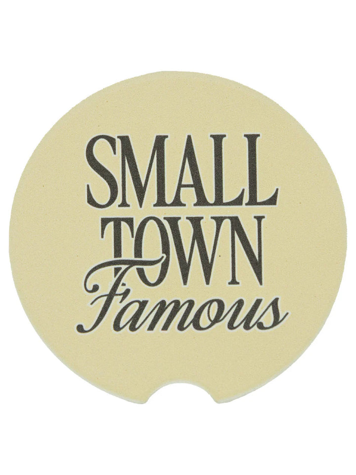 Beige, circular Simply Southern car coasters, "SMALL TOWN Famous" script. Water-absorbent. Fits standard cup holders.