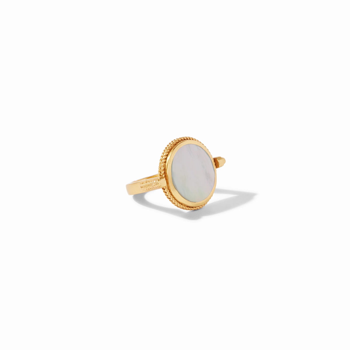 The Coin Revolving Ring by Julie Vos has a round mother-of-pearl center with a textured gold bezel. Available in multiple sizes.