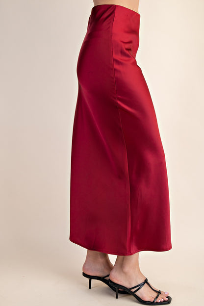 Sally Satin Midi Skirt: deep red, high-waisted, long satin midi. Available in sizes XS–XL.