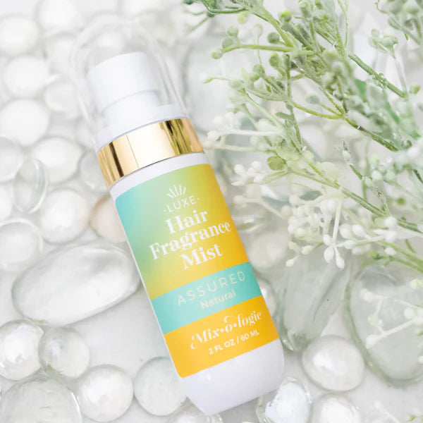 White and gold "Hair Fragrance Mist" bottle. Available in 50ml and 100ml sizes. Lightweight, long-lasting scented mist.