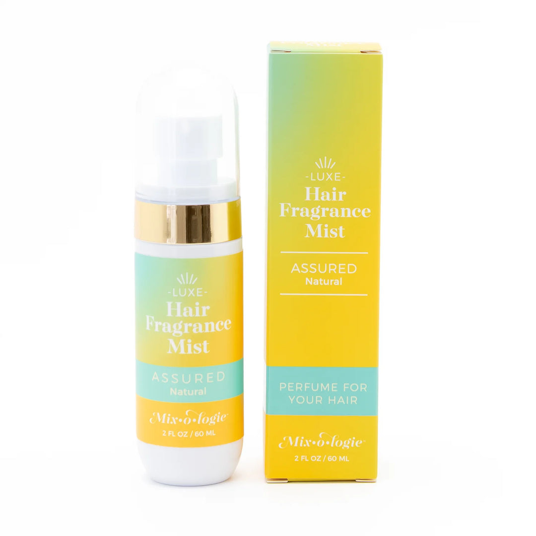 2 fl oz (60 mL) Hair Fragrance Mist bottle and box with yellow-teal gradient and gold accents. Long-lasting, lightweight scent.