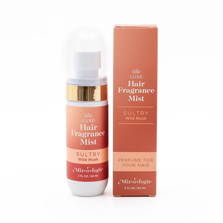 Hair Fragrance Mist "Sultry Wild Musk," peach and gold packaging, 2 fl oz (60 mL), for soft, scented hair.