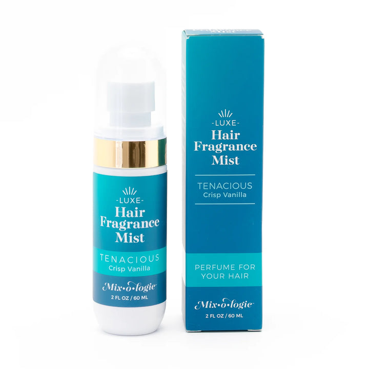 2 fl oz (60 ml) Tenacious Crisp Vanilla Hair Fragrance Mist in teal, white, and gold packaging; lightweight and fresh.