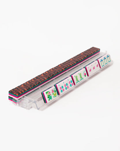 Glow Wild Mahjong Tiles with vibrant, colorful designs are displayed upright in a clear rack. Available in standard and large sizes.