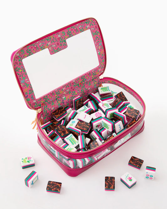 Clear pink zippered case with a large window and gold zipper pulls, featuring floral interior, holds colorful Glow Wild Mahjong Tiles. Available sizes: not specified.