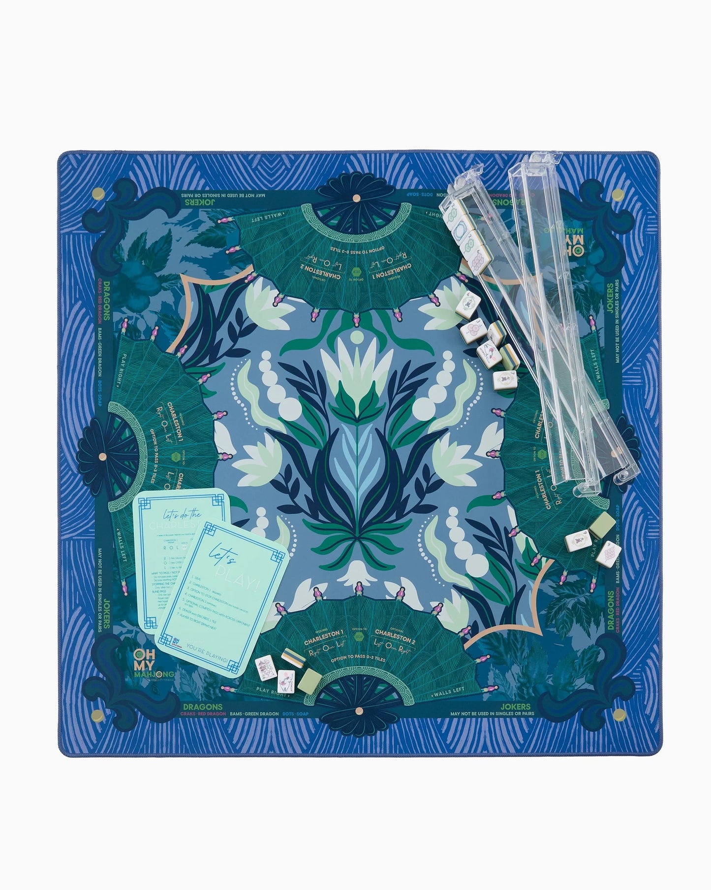 Mahjong Jade Mat in Tube with blue and green floral-patterned neoprene surface, bold shapes, and symmetrical patterns. Available in multiple sizes.