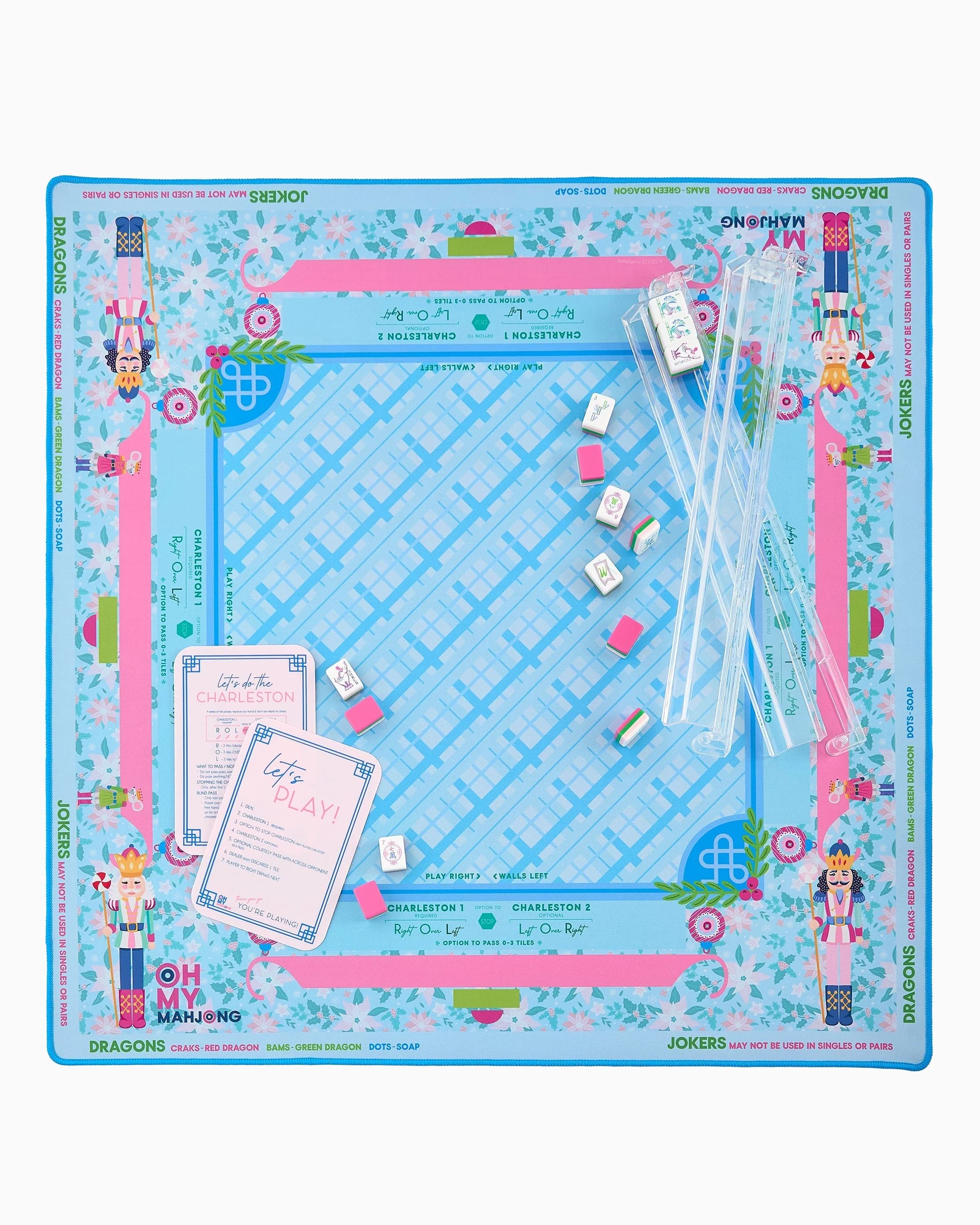 The Mahjong Sugarplum Mat is a vibrant neoprene mat with blue, pink, and green hues and playful floral illustrations. Available in multiple sizes.