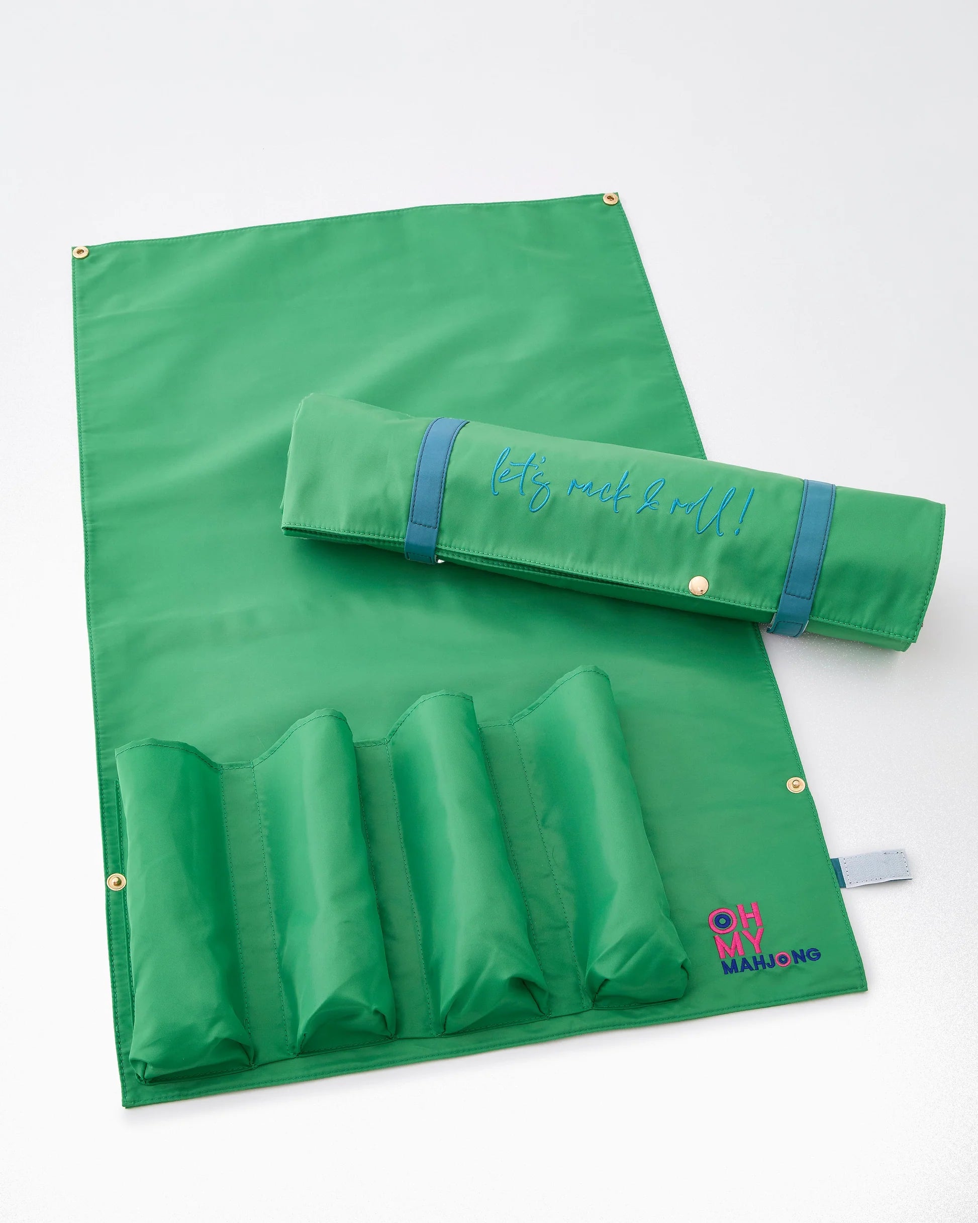 Kelly Green Let’s Rack and Roll Bag: compact mahjong mat organizer in vibrant green fabric with built-in tile holders, embroidered blue “let’s rack & roll!” phrase, and “OH MY MAHJONG” in pink and blue on the bottom right. Size: 18.5" wide.