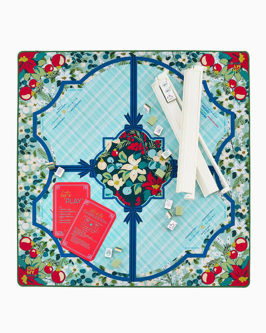 The Winterberry Mat in Tube features vibrant floral and fruit patterns. Available sizes: standard and large.