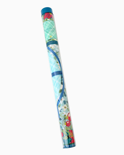 Colorful cylindrical tube with blue cap and floral designs, for packaging or storing the Winterberry Mat in Tube; available in multiple sizes.