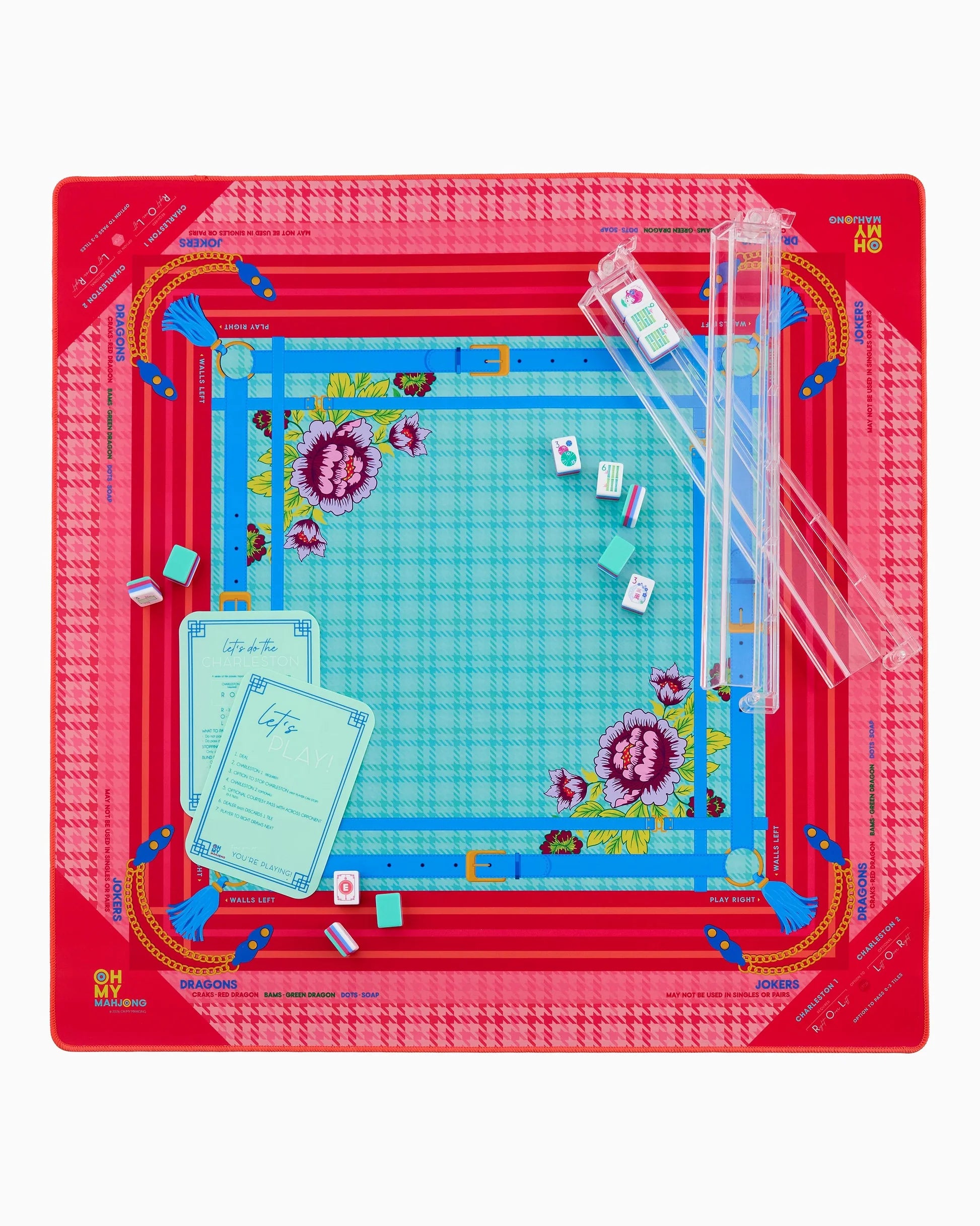 Penelope Mat in Tube with red and blue patterns and a floral center. Available sizes: small, medium, large.