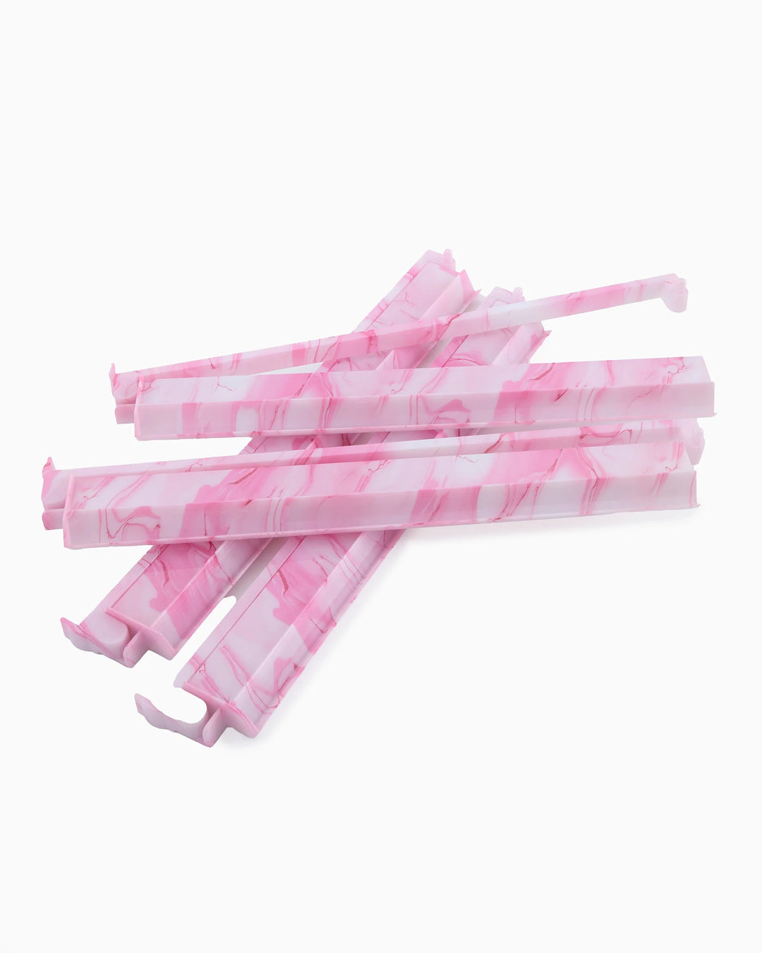 Five pink and white marbled plastic rack pushers, available in standard and large sizes.