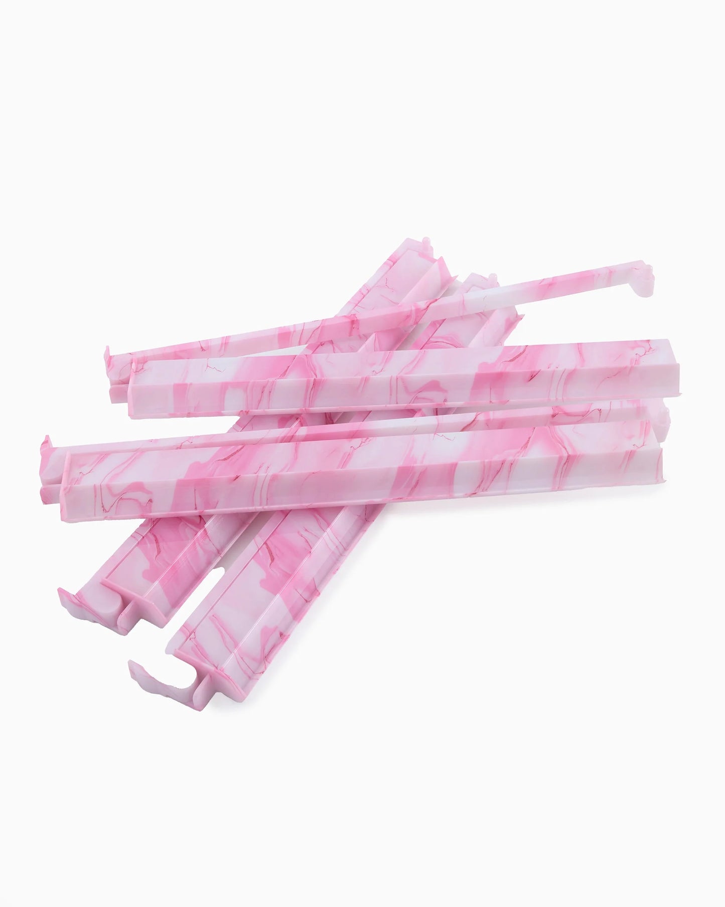 Five pink and white marbled plastic rack pushers, available in standard and large sizes.