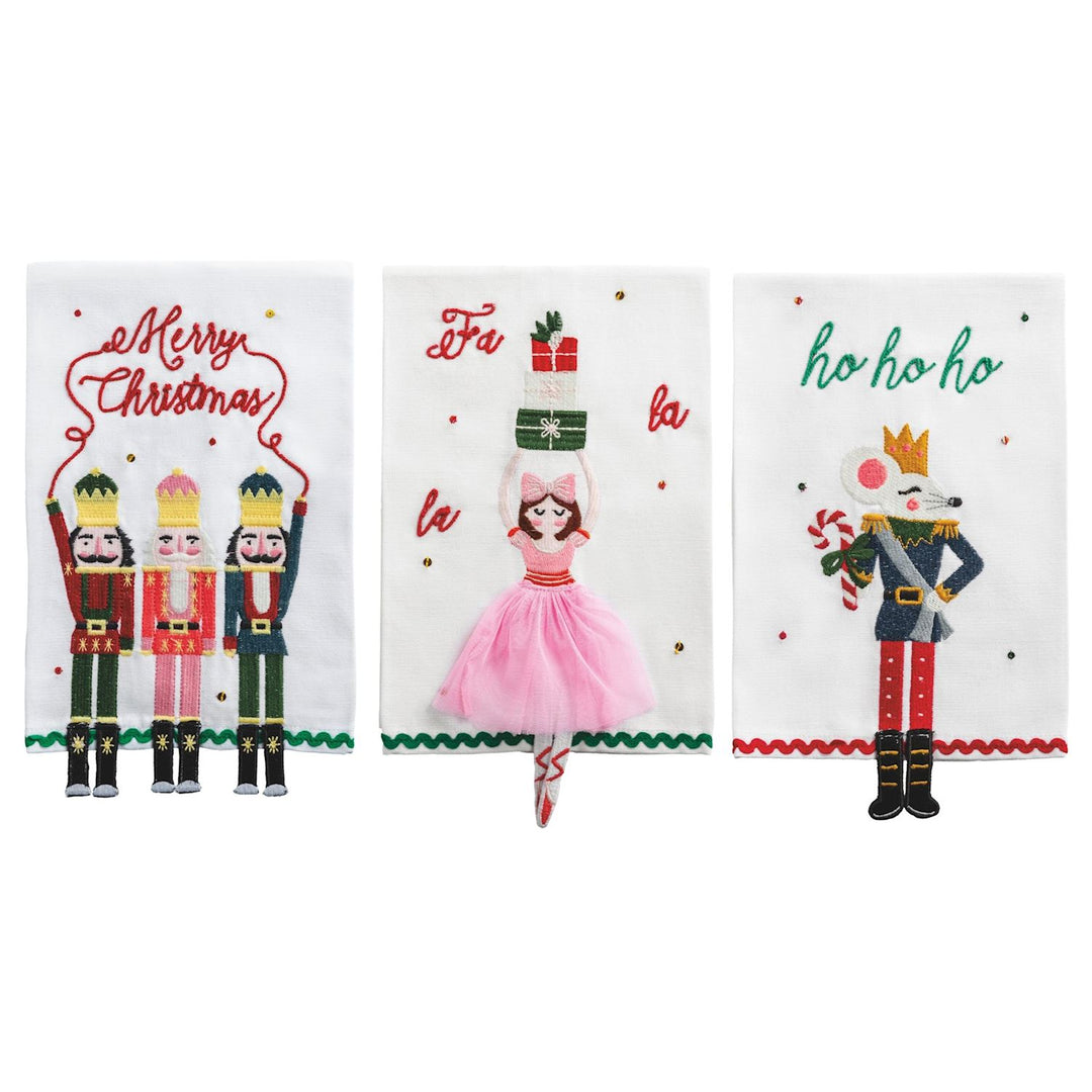 Three white hand towels with nutcracker, ballerina, and mouse embroidery.