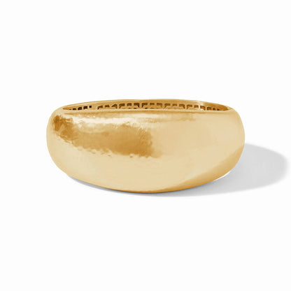 Wide, hand-hammered gold bangle with a shiny finish and geometric piercework along the inner edge; available in multiple sizes.