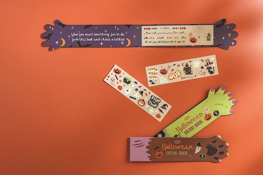 Halloween Tattoo Books: 3 sheets of non-toxic kids' tattoos with spooky designs, orange cover. Sizes available: standard only.