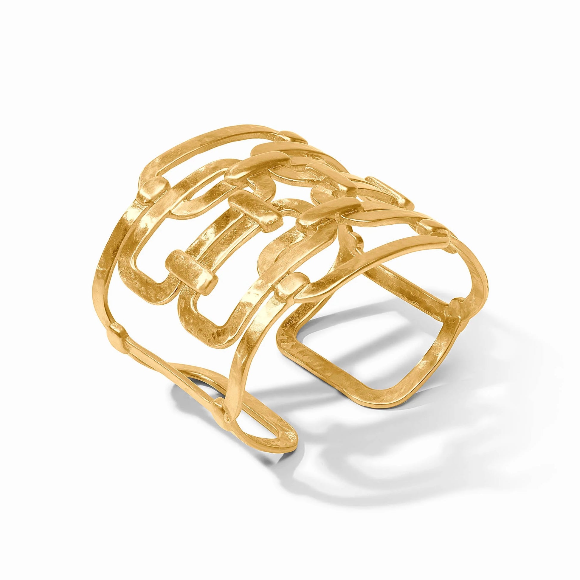 Wide openwork gold cuff with abstract interlocking geometric design; available in small, medium, and large sizes.