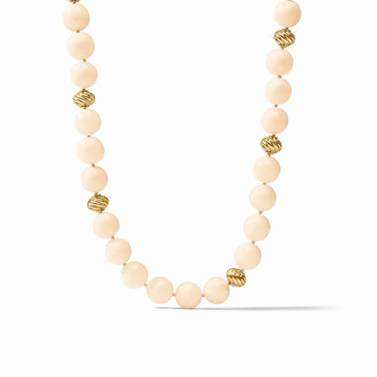 The Ravello 5-in-1 Ivory Necklace Gold by Julie Vos features round cream-colored beads with textured 24K gold-plated bead accents, adjustable length. Sizes available.