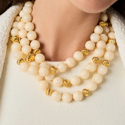 Julie Vos Ravello 5-in-1 Ivory Necklace Gold: multi-strand cream beads, 24K gold-plated with spiral accents. Available in one adjustable size.