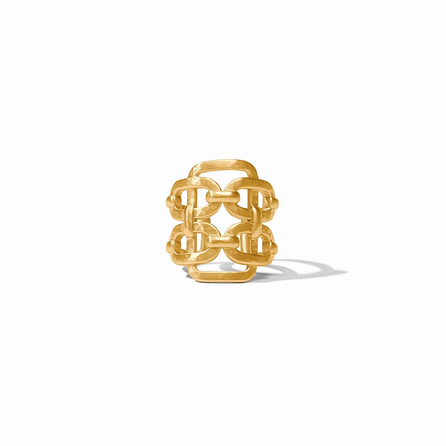 The Sahara Statement Ring is a wide gold band with an openwork geometric design, available in sizes 6-9.