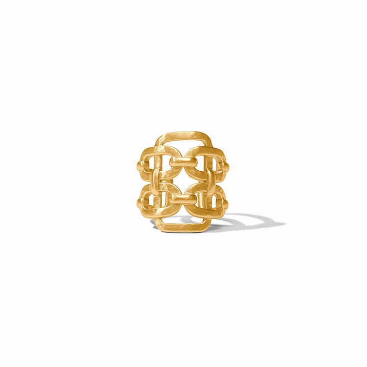 The Sahara Statement Ring is a wide gold band with an openwork geometric design, available in sizes 6-9.