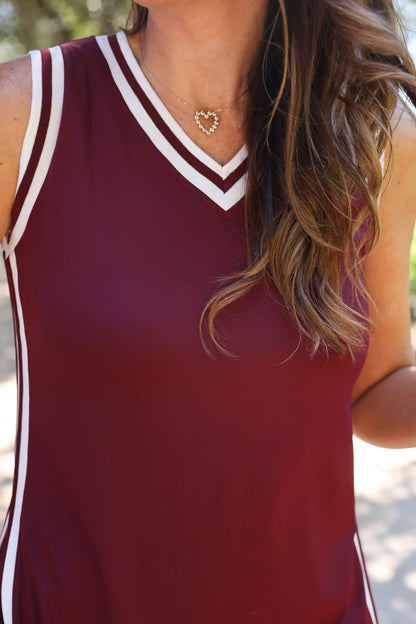 Sideline Tunic Biker Set: sleeveless maroon top with white trim. Available in sizes XS–XL.