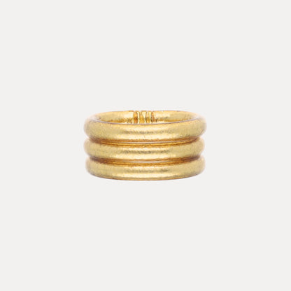Set of three rounded gold bands, stacked together; waterproof and durable. Available in Size 7.