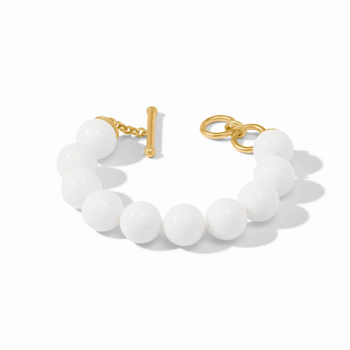Large round white jade beads with a 24K gold plate toggle clasp. Available sizes: S, M, L.