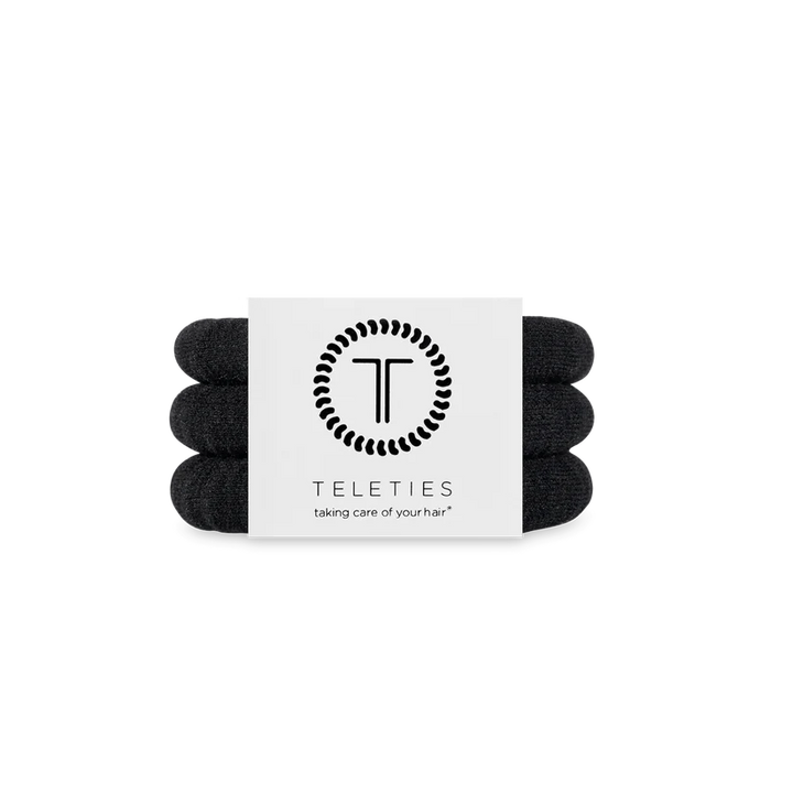 Three Jet Black TELETIES hair ties stacked on a branded card. Available in small, medium, and large sizes.