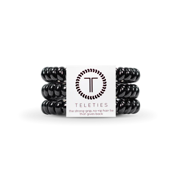Three Jet Black TELETIES spiral hair ties with a white label; available in small, medium, and large sizes.