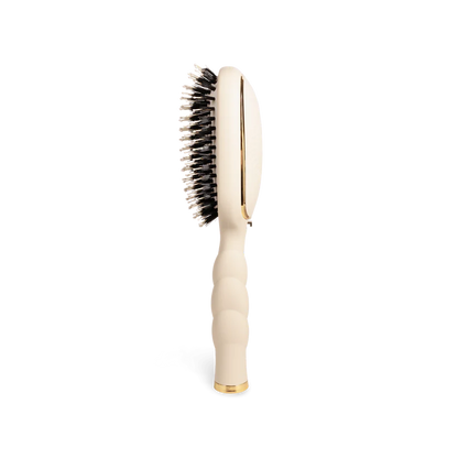 Teleties Hair Brush: cream vented design, black anti-static bristles, gold accents, ribbed handle. Available in multiple sizes.