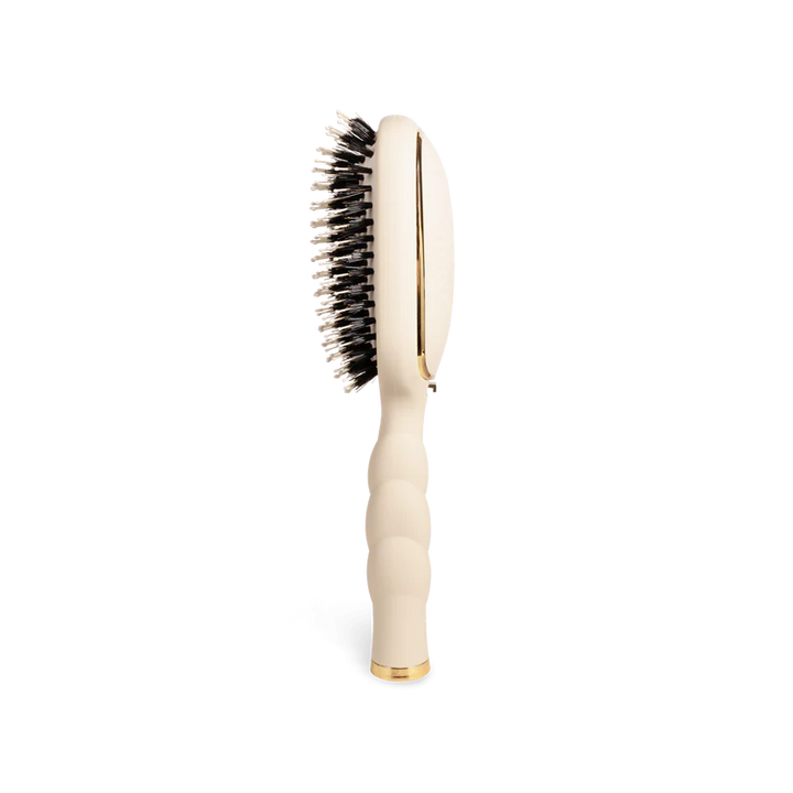 Teleties Hair Brush: cream vented design, black anti-static bristles, gold accents, ribbed handle. Available in multiple sizes.
