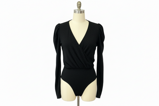 Black Long Sleeve Bodysuit by White Birch with deep V-neck and subtle puffed shoulders. Available in sizes S-XL.