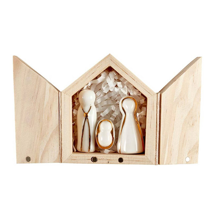 Holy Family Figurine | Santa Barbara: three minimalist white ceramic figures with gold trim.