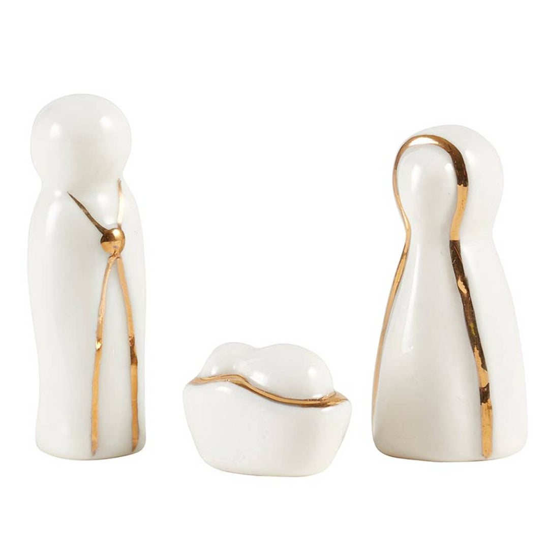 Minimalist white porcelain Holy Family figurine set with gold trim in a Joy to the World box.