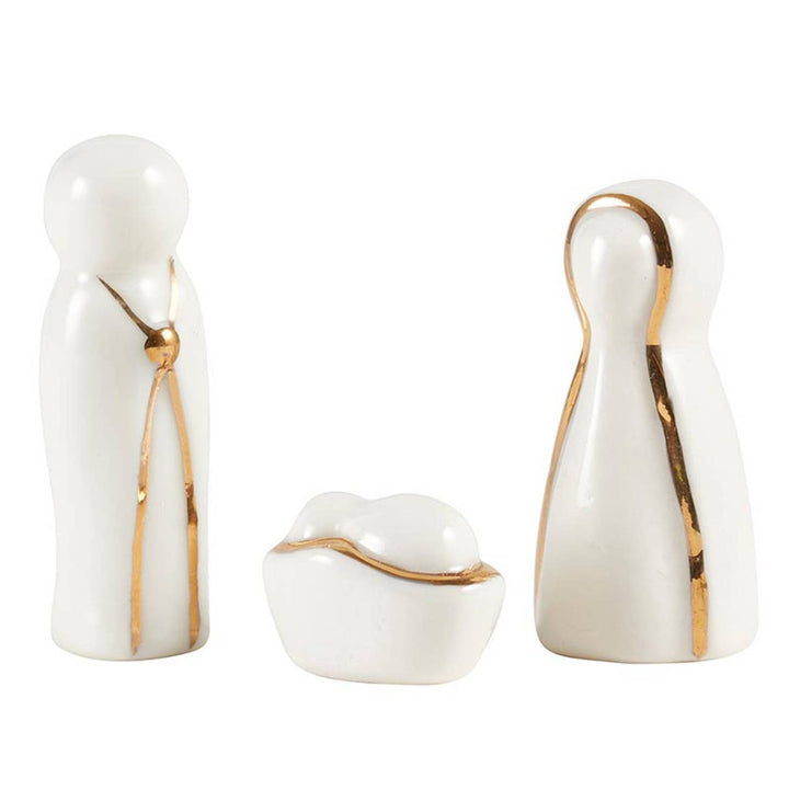 Minimalist white porcelain Holy Family figurine set with gold trim in a Joy to the World box.