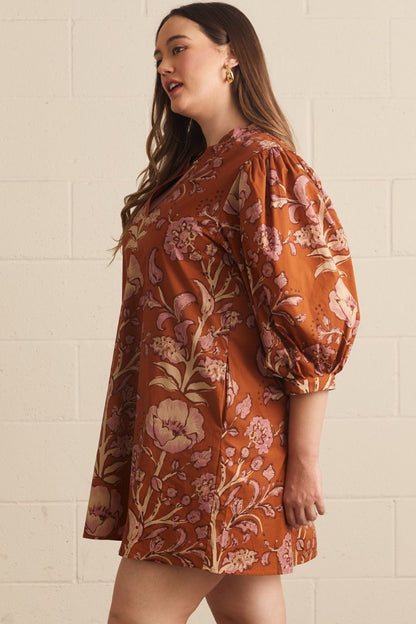 Autumn Rust Long-sleeve Dress with floral pattern. Available in sizes XS–XL.