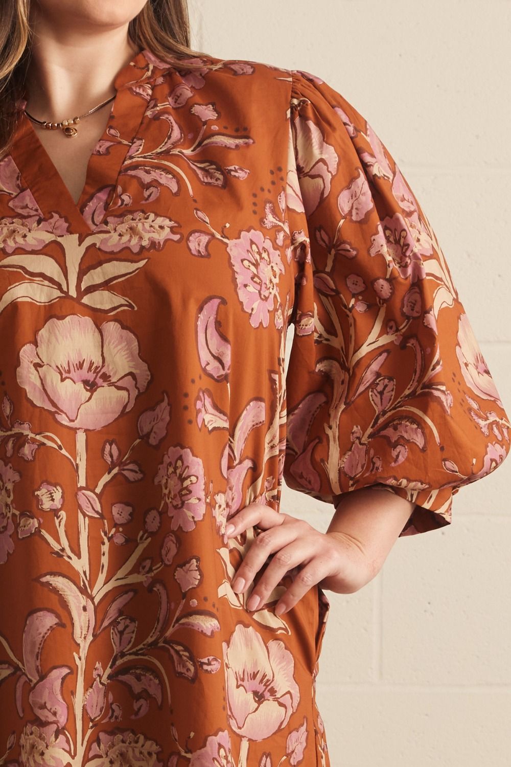 Autumn Rust Long-sleeve Dress with pink floral patterns and puffed sleeves; available in sizes XS-XL.