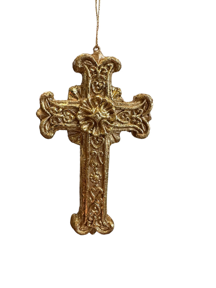 Gold cross Christmas tree ornament with intricate scrollwork.